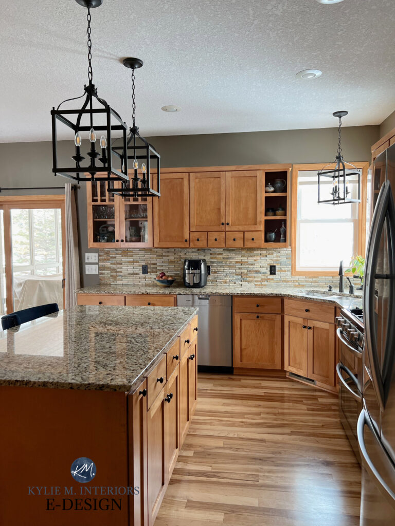 Kitchen with wood cabinets, wood floor and island, granite countertop, mosaic travertine stone backsplash, wood trim, Benjamin Moore Texas Leather walls.