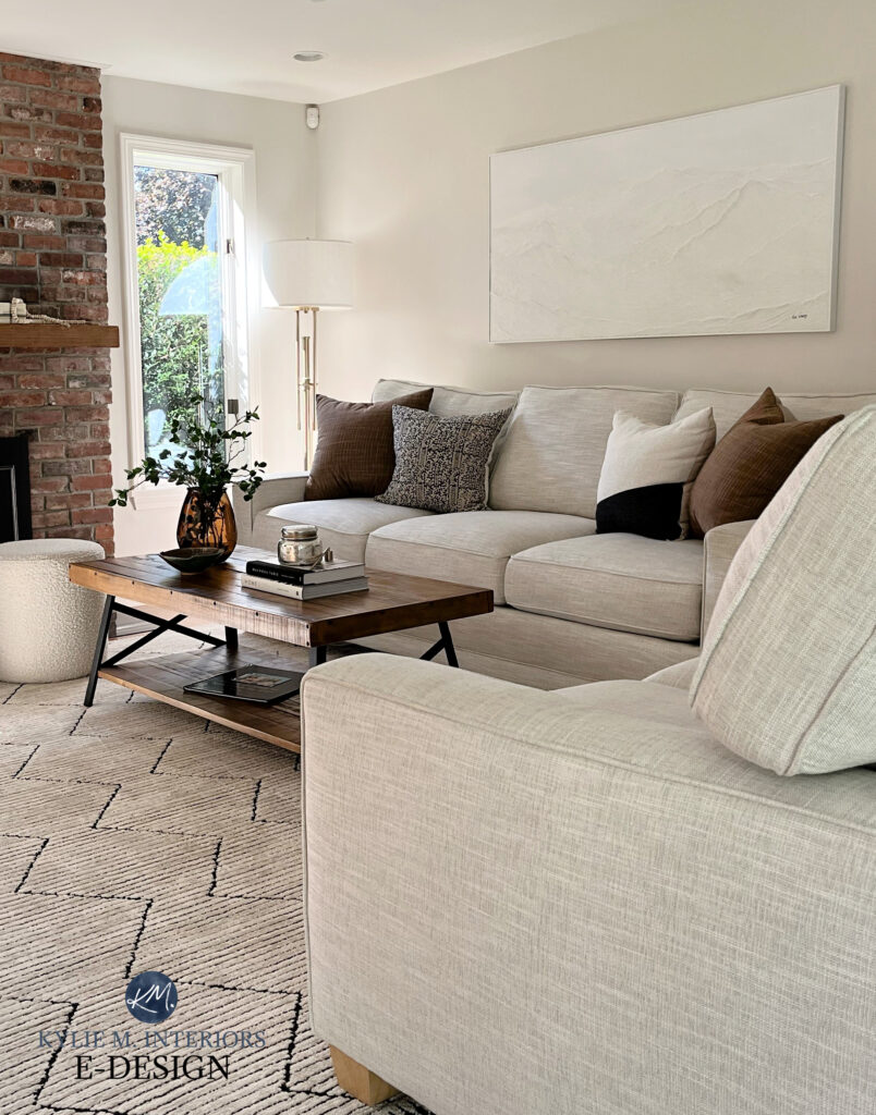 Sherwin Williams Egret White, best neutral greige taupe warm gray paint color, fabric sofa, brick fireplace, home decor. Kylie M Online Paint color consulting, coffee table decor