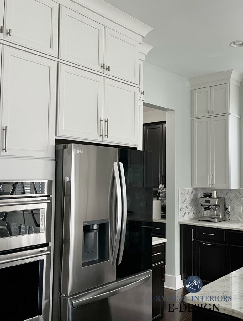 Wood kitchen cabinets painted Sherwin Williams Drift of Mist, light gray or greige paint color, granite countertops