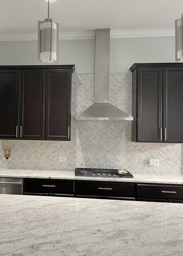 kitchen before with dark espresso wood cabinets, granite countertops