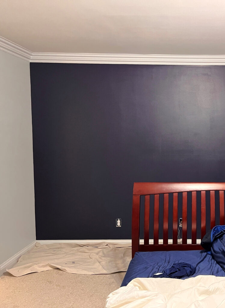 navy blue feature or accent wall in teen boys bedroom, Sherwin Williams Charcoal Blue by Kylie M, beige carpet