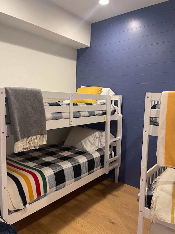 BLUE NOVA in a kids bunk room with white bunk beds and Benjamin Moore White Dove