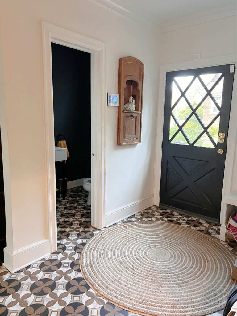 Sherwin Williams Alabaster, mudroom, entryway, black painted inside of door, graphic pattern tile floor, Extra White, door to powder room. Kylie M client photo, Online paint color consultant