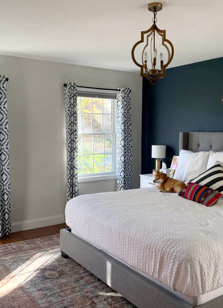 Benjamin Moore Hale Navy, Silver Satin, primary bedroom, wood floor, gray upholstered bed. Off white warm gray wall color. Kylie M blog (1)