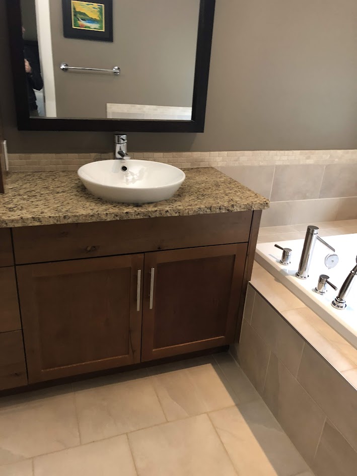 bathroom, pink beige tile floors, travertine tile detail, st cecelia granite countertops, vessel sink, hickory wood cabinets. Kylie M update ideas