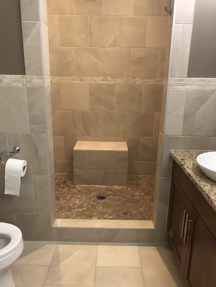 beige pink taupe 12x12 tile in bathroom and walk in shower, travertine accent, granite countertop. Kylie M update ideas