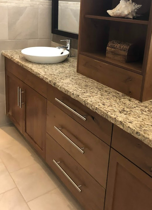 ugly, long cabinet hardware on bathroom vanity, hickory wood, st cecelia granite countertops, honed edge, beige tile floor. update ideas