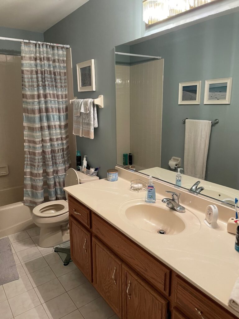 1990 bathroom before update, wood oak vanity, tile floor, taupe tub surround (1)