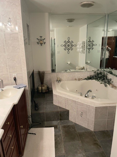 1990 bathroom update ideas, wall tile, floor tile, soaker corner tub with tile deck.