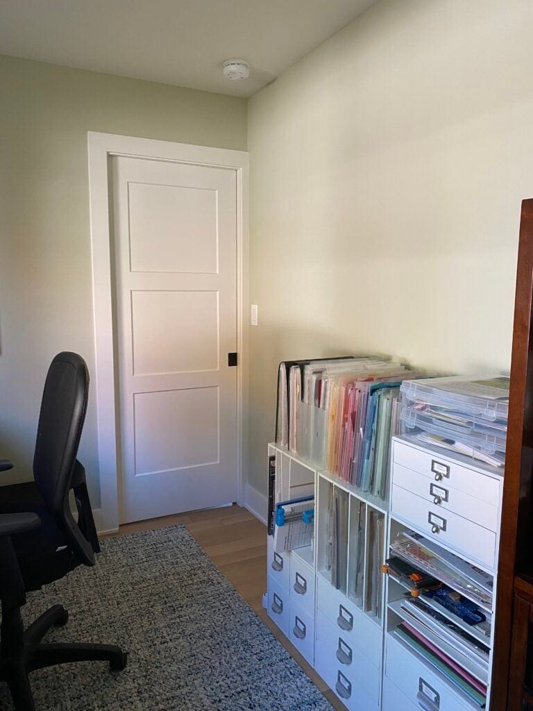 Ancient Marble in office with white trim, light green paint color on walls with wood floor