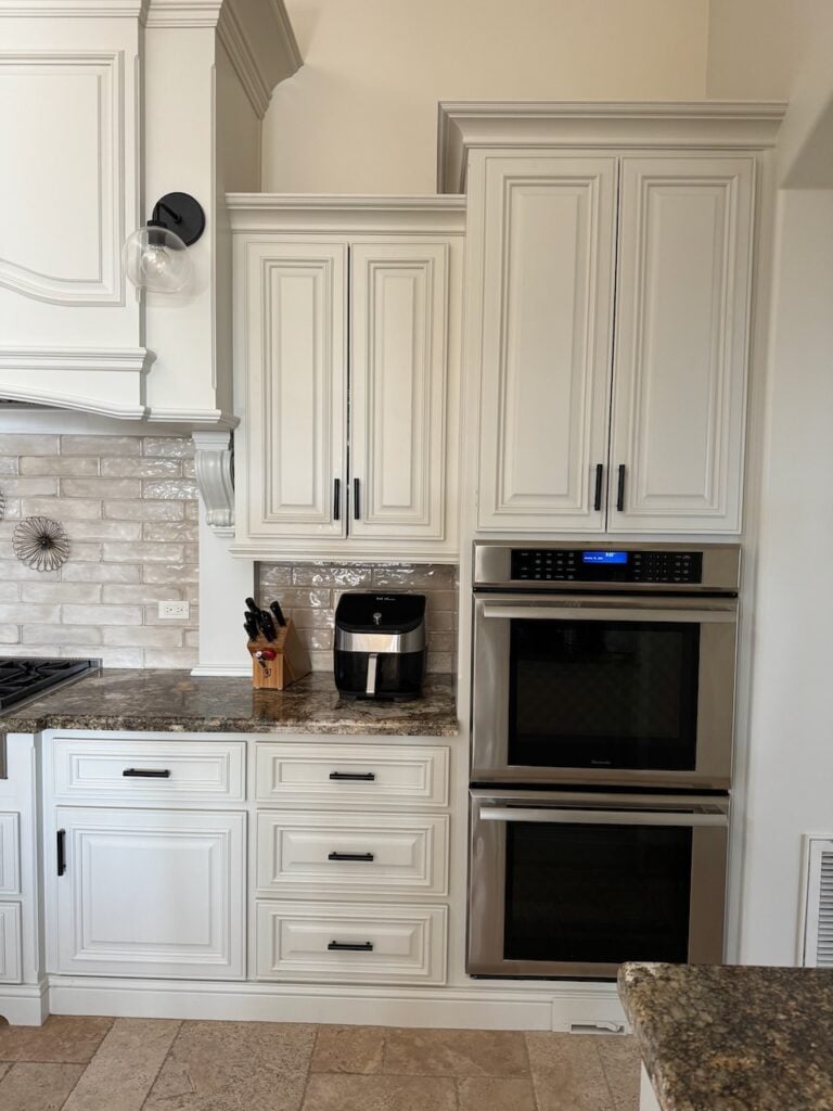 BEFORE 2000s granite kitchen countertops, subway tile backsplash, off white cabinets, Dove Wing walls, needs new paint colors, TUSCAN STYLE
