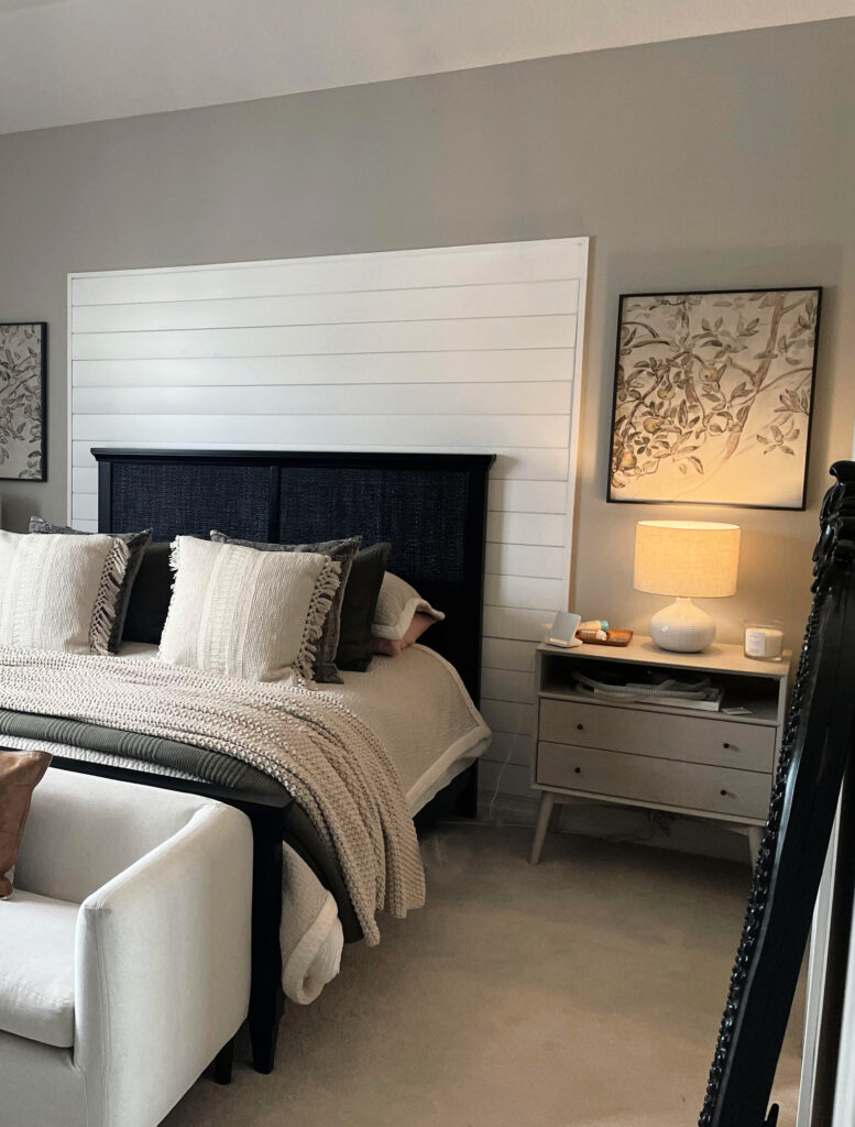 Benjamin Moore Revere Pewter, shiplap, beige taupe carpet, sofa at end of bed, Kylie M online paitn color expert client bedroom photo. Neutral boho linens and home decor