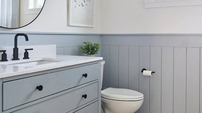 Sherwin Williams Network Gray shiplap in small bathroom with matching vanity and White Dove walls