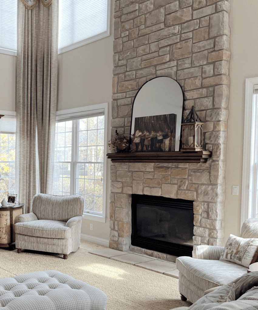 Sherwin Williams Natural Linen, great room, living room vaulted ceiling, stone fireplace, cherry wood maple built ins with tv, beige carpet and drapes, Extra White trim