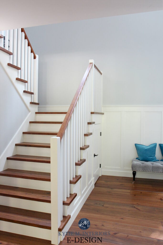 Stairs, wood tread, white riser and wood railing and spindles. White wainscoting Cloud White, walls Benjamin Moore Gray Owl. Reclaimed pine wood flooring,