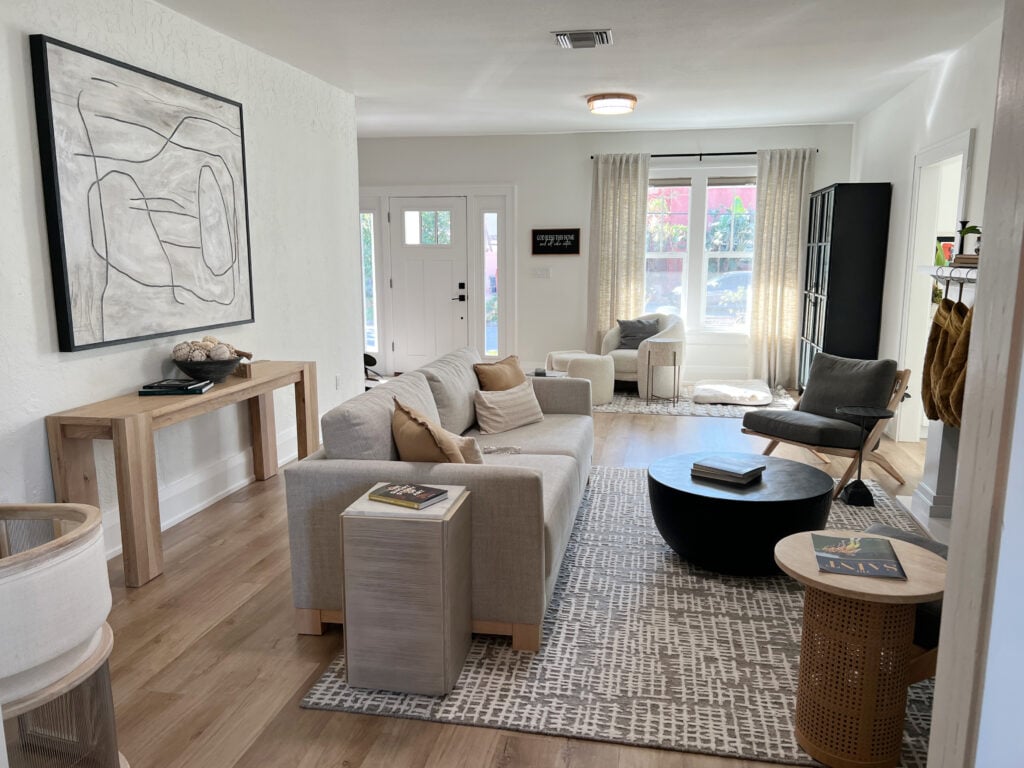 Sherwin Williams Greek Villa 25% lighter, Extra White trim, neutral beige cream furniture, light warm woods, south facing. Home decor, oversized art, front door