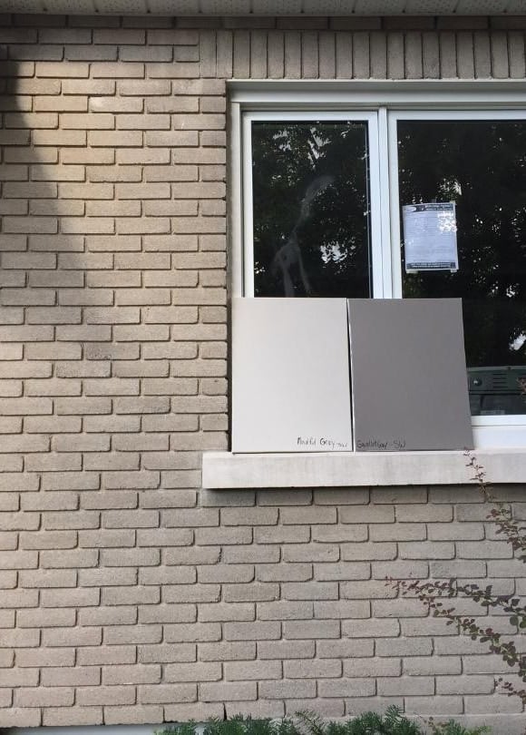 Sherwin Williams Mindful Gray and Gauntlet Gray with concrete ledge on window, taupe warm pink gray brick exterior