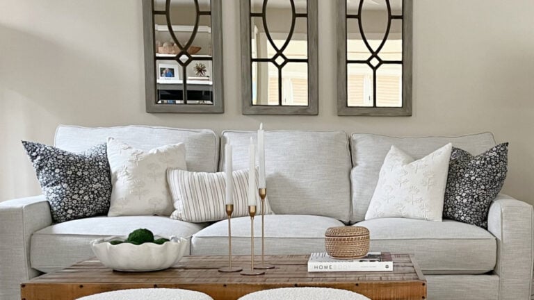 Sherwin Williams Neutral Ground with off-white sofa, mirrors and toss cushions Coffee table decor