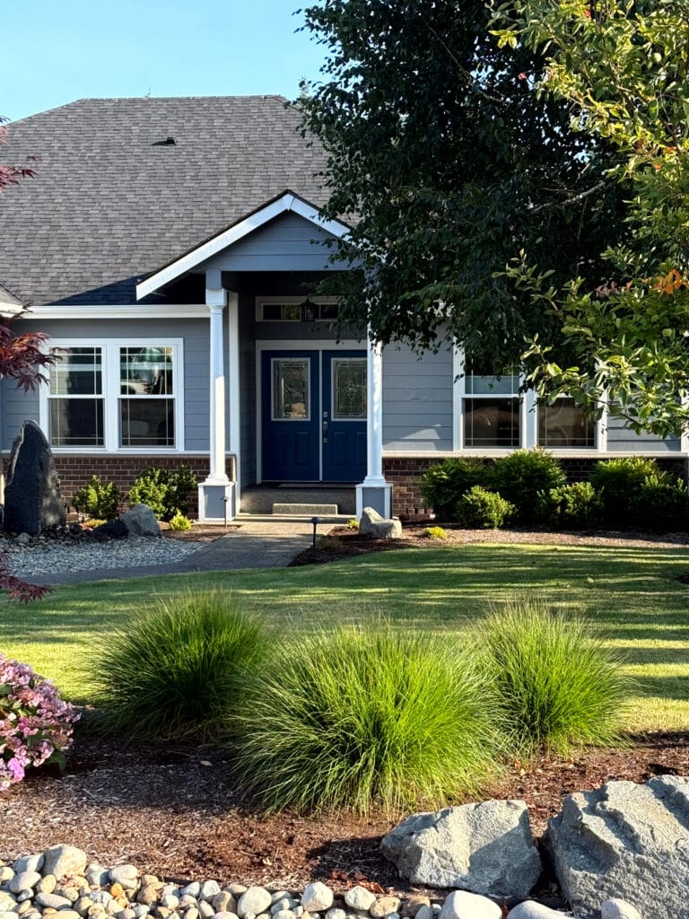 Sherwin Williams Dustblu, blue gray exterior paitn color, dark purple red brick, white trim