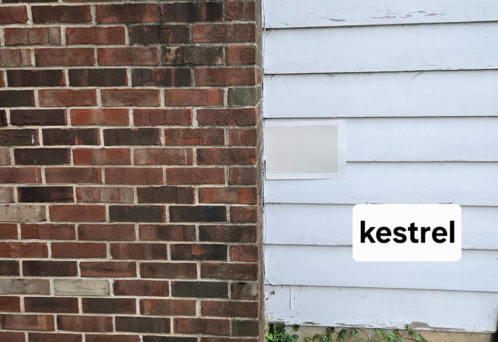 Sherwin Williams Kestrel White with red brick exterior