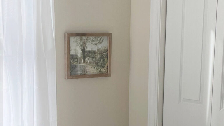 Sherwin Williams Natural Linen beige paint color on walls with white trim