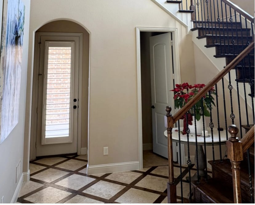 2000s staircase update ideas without replacing, dark wood, travertine, wrought iron, similar to Kilim Beige walls with cream trim