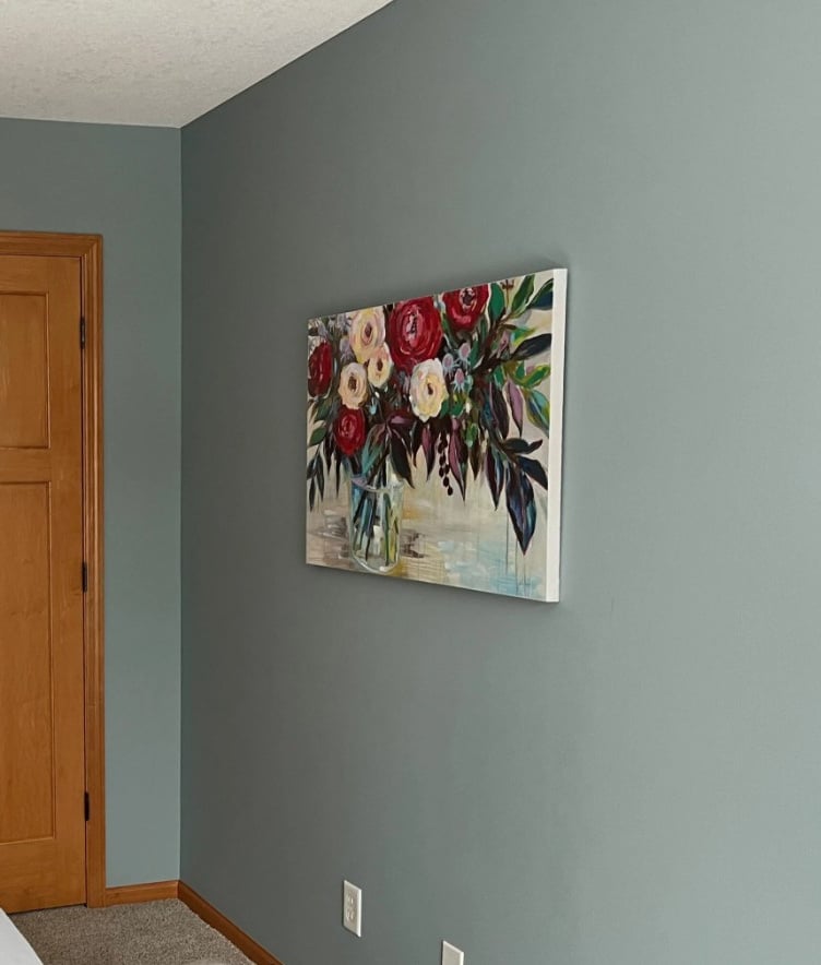 BEnjamin Moore Mount Saint Anne, a blue-gray paint color on walls with orange wood trim and door