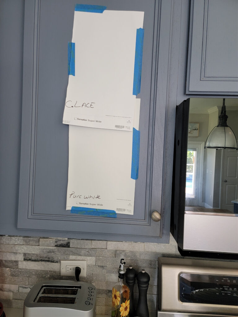Benjamin Moore Chantilly Lace and Sherwin Williams PUre White comparing paint samples