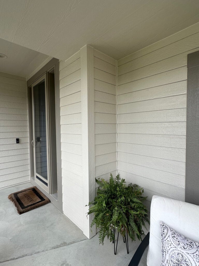 Benjamin Moore Edgecomb Gray on the exterior of a home with Graystone trim, beige taupe tan windows
