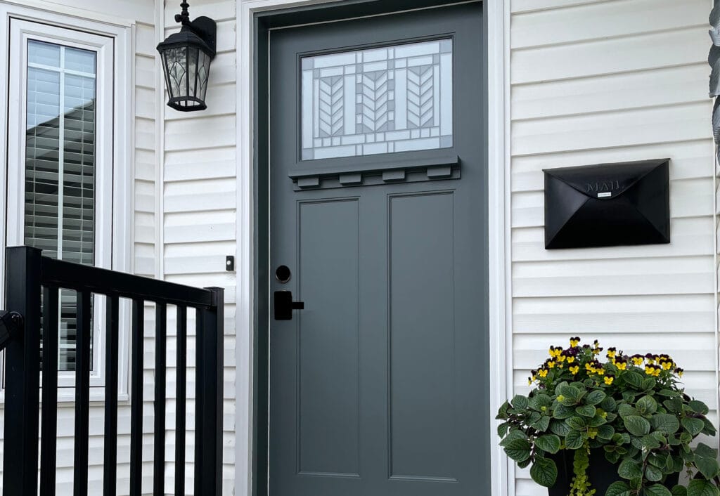 Benjamin Moore Kitty Gray, best green gray paint color for front door, black mailbox and accents, craftsman style door, white vinyl siding.