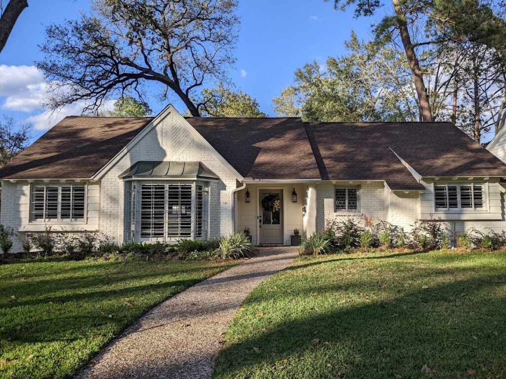 Benjamin Moore Seapearl south or west-facing sun exterior, warm off-white with taupe roof