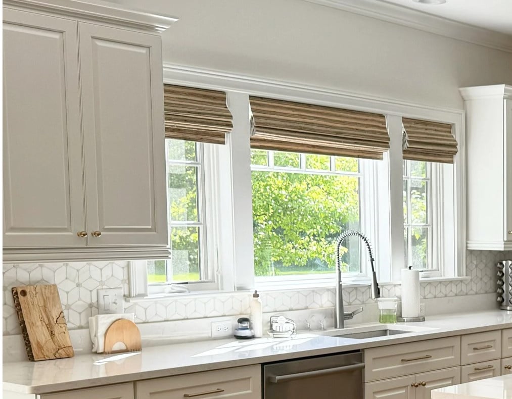 Benjamin Moore White Dove painted kitchen cabinets, Peale Green island, Sherwin Williams Pearly White walls (off white), white quartz, golden oak floor, 1990s early 2000s