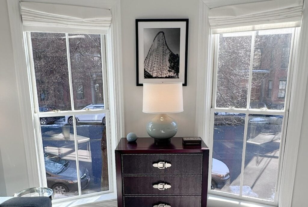 Benjamin Moore White OC 151 on trims, Paper White walls, warm gray taupe carpet, home decor and lamp with sunshine coming in the windows