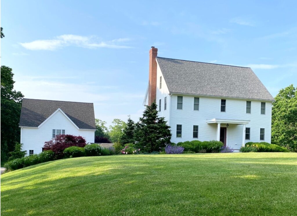 Bright white exterior painting siding, farmhouse style, landscaping, taupe or warm gray roof, white windows, best white paint color for exterior