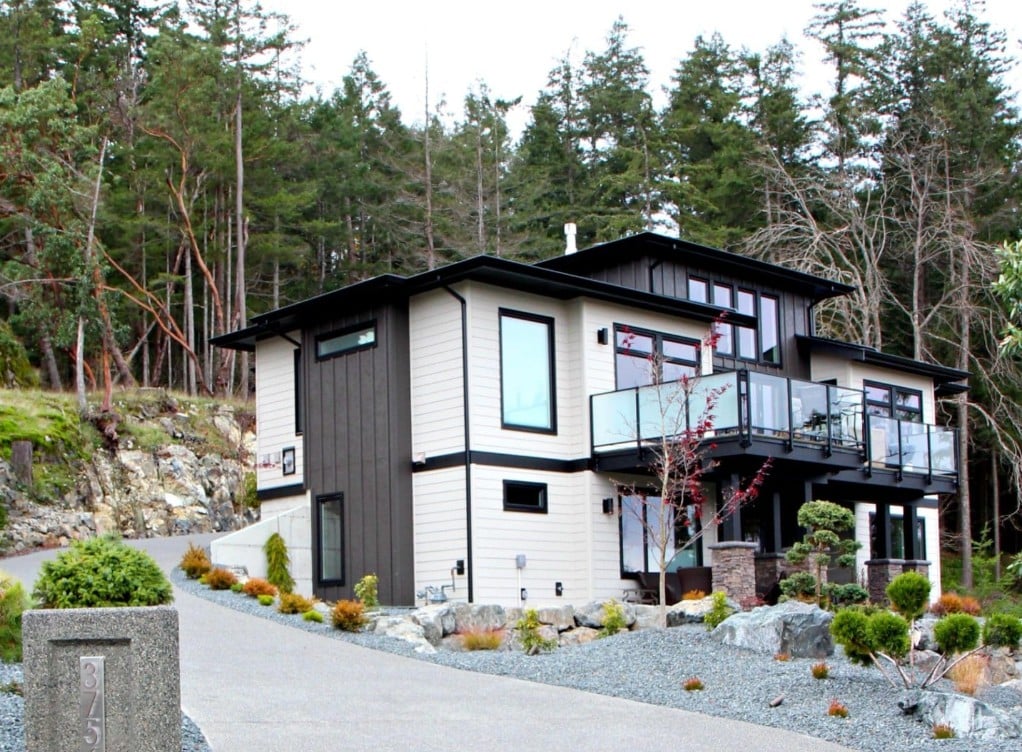 James Hardie Cobblestone and dark brown, black gutters, soffits and windows exterior house
