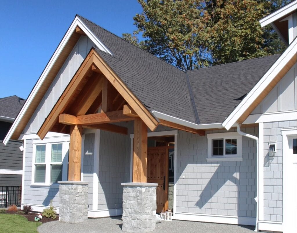 James Hardie Light Mist exterior siding and shaskes, gray stone, light gray siding with white trim, cedar or fir beams, soffts, gable or fascia trim and front door