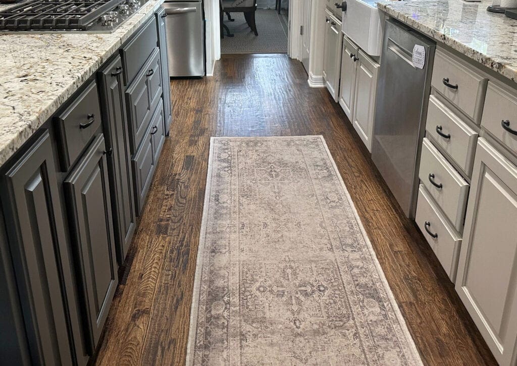 Kitchen, wood floor, cabinets painted Benjamin Moore Pashmina, island Urbane Bronze greige, granite countertop