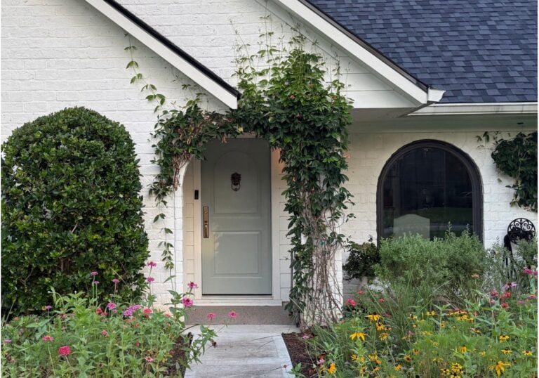 Romabio white brick with painted trim in Sherwin Williams Pure White, gray-green front door is Oyster Bay, bunaglow, arched window exterior