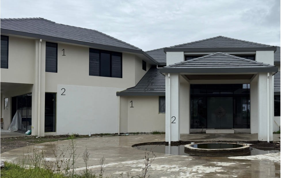 Modern contemporary exterior. Samples of Sherwin Williams Accessible Beige and Aesthetic White on painted stucco with dark gray taupe roof, black windows