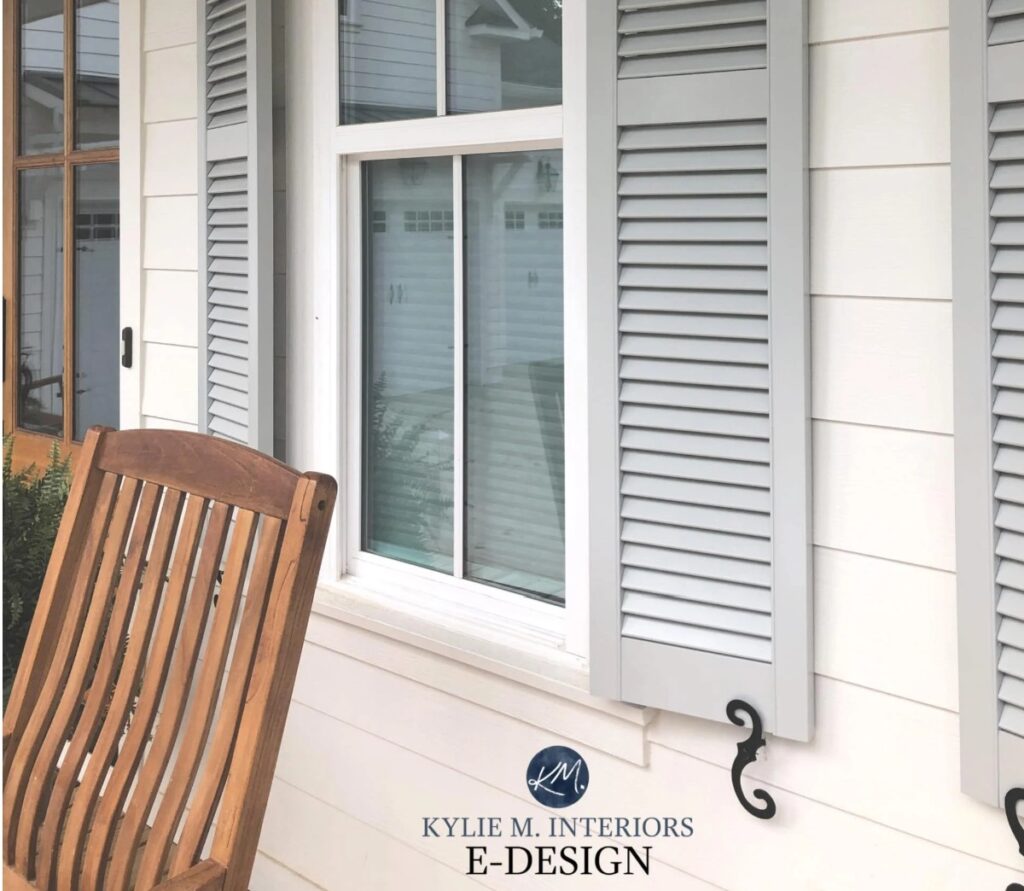 Sherwin Williams Alabaster painted exterior siding, best white paint color, green-gray shutters, white windows, wood front door