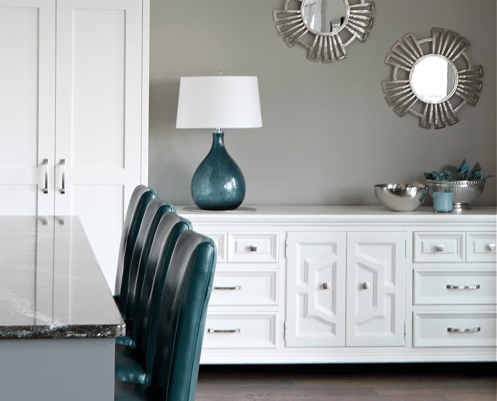 Sherwin Williams Dovetail accent wall with bright white cabinets, teal blue accents