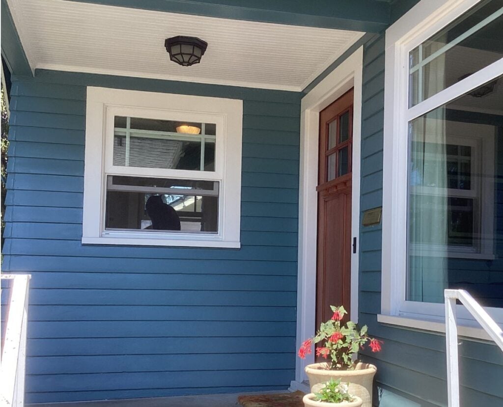 Sherwin Williams Snowbound exterior trim, white windows, blue siding is Sherwin Williams Mediterranean Blue