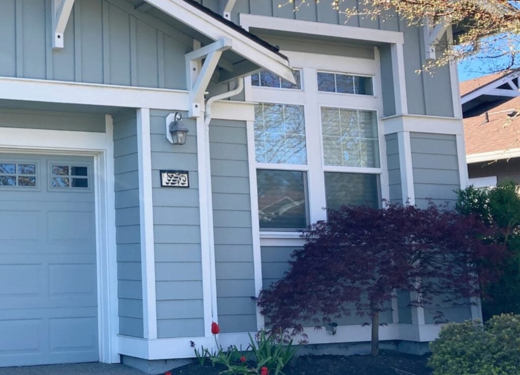 Should garage door match siding color or trim color on exterior. Shown here, Alabaster trim with blue-gray-green siding color