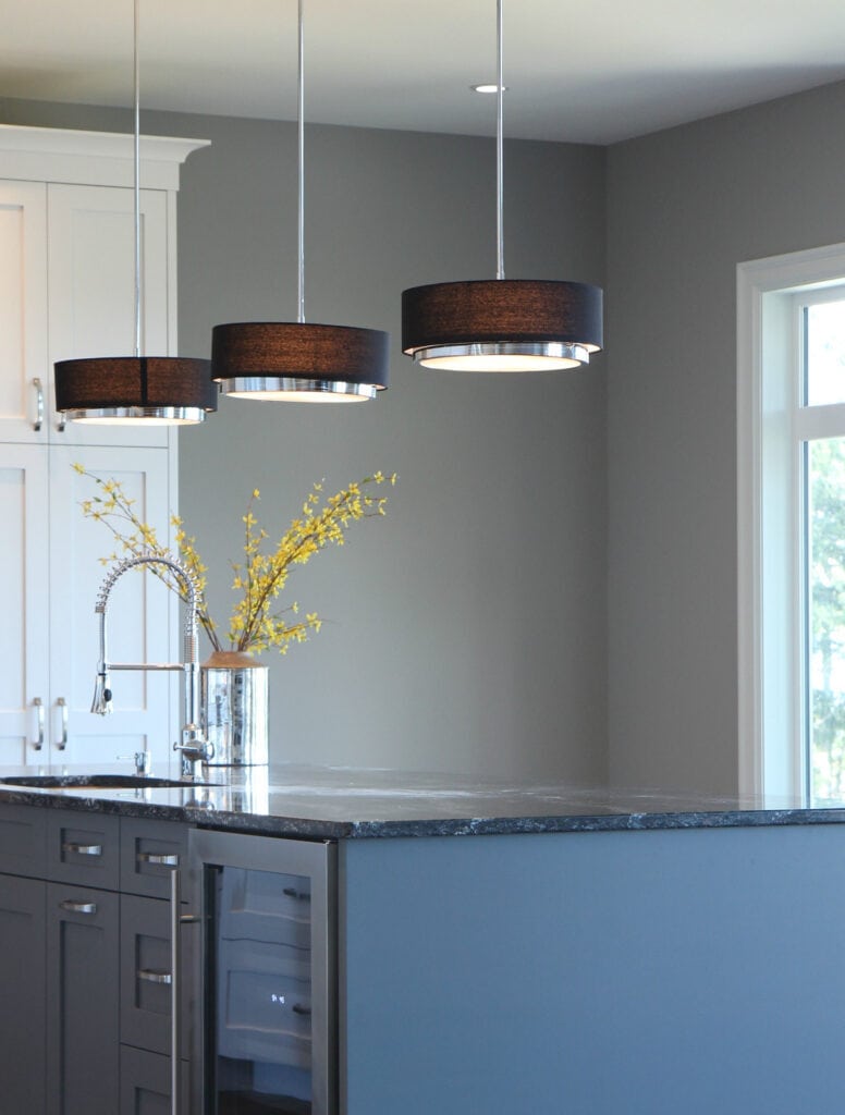 Sherwin Williams Dorian Gray in kitchen with island and black veined granite countertop