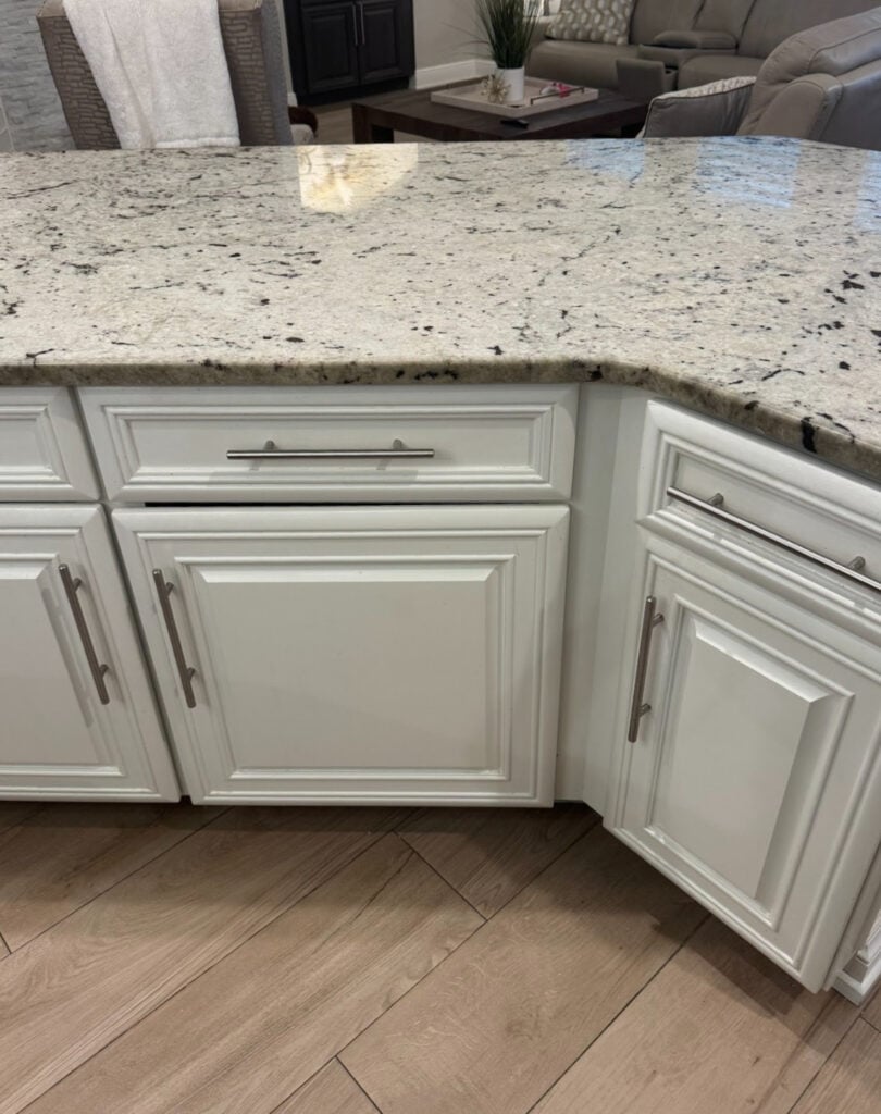 Benjamin Moore White Dove on cabinets with early 2000s granite countertop