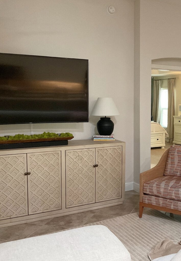 herwin Williams Aesthetic White walls in living room with tv cabinet and tile flooring