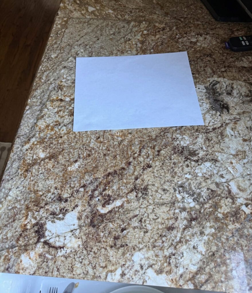 Granite countertop with beige and gold from early 2000s, tuscan style home