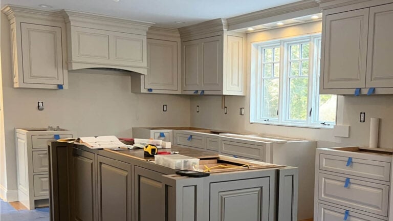 Sherwin Williams Accessible BEgie painted kitchen cabinets with Porpoise (Greige) island