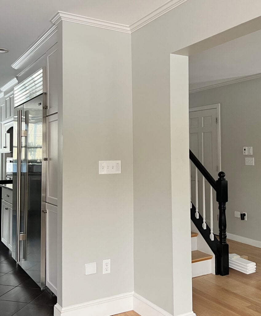 Sherwin Williams Repose Gray with wood flooring and soft white trim