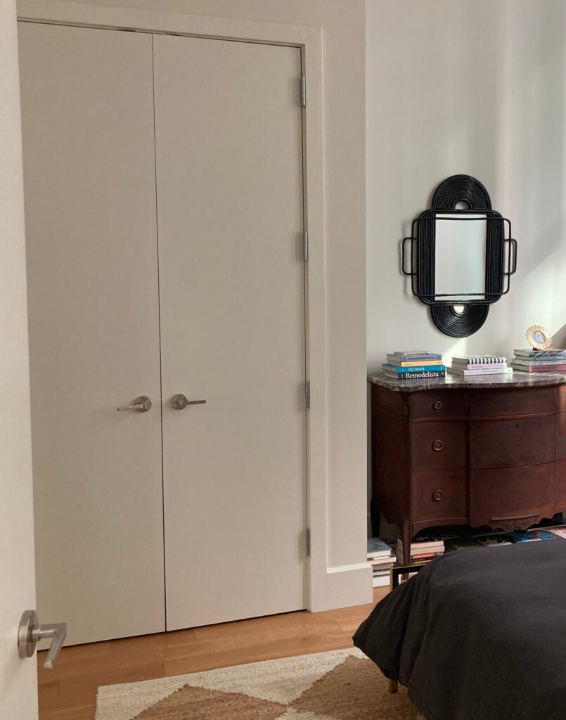 Benjamin Moore China White or Seapearl color drench on walls and trims in south facing natural light, cherry red wood furniture